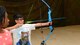 A child shoots an arrow during an archery training class put on by the Youth Center at Ellsworth Air Force Base, S.D., June 13, 2018. The Youth Center has five specialty courses planned for the summer months, including archery and music courses. (U.S. Air Force photo by Airman 1st Class Nicolas Z. Erwin)