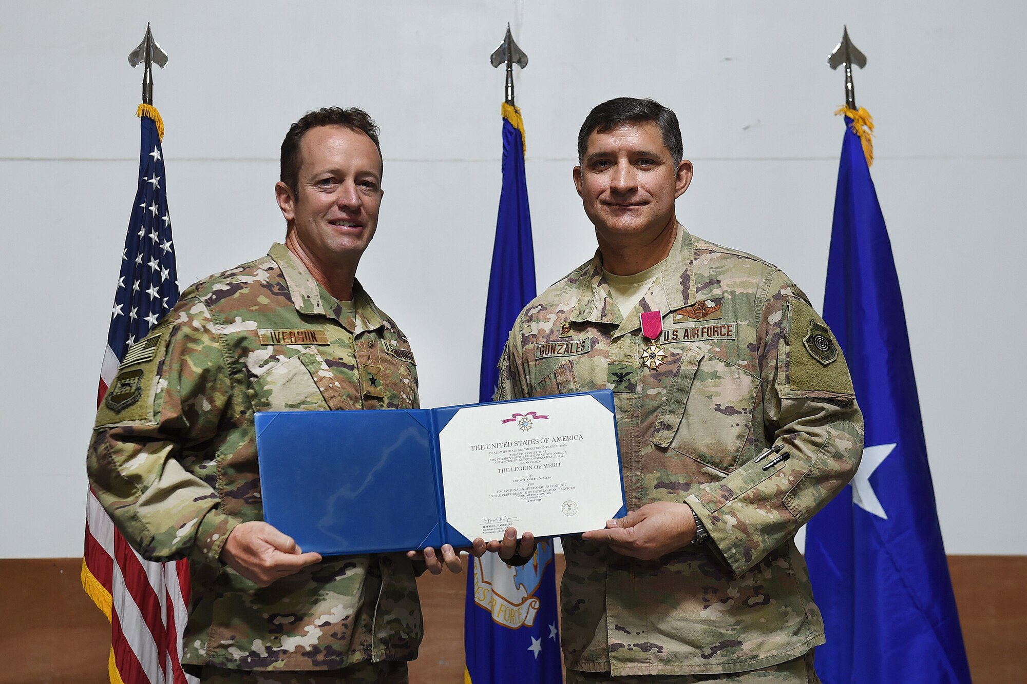 Two Airmen pose for a photo