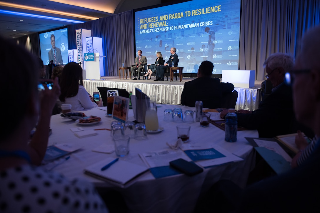 U.S. Institute of Peace President Nancy Lindborg moderates a discussion between U.S. Agency for International Development Administrator Mark Green and Air Force Gen. Paul J. Selva, vice chairman of the Joint Chiefs of Staff, during the U.S. Global Leadership Coalition’s 2018 State Leaders Summit in Washington.