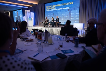 U.S. Institute of Peace President Nancy Lindborg moderates a discussion between U.S. Agency for International Development Administrator Mark Green and Air Force Gen. Paul J. Selva, vice chairman of the Joint Chiefs of Staff, during the U.S. Global Leadership Coalition’s 2018 State Leaders Summit in Washington.