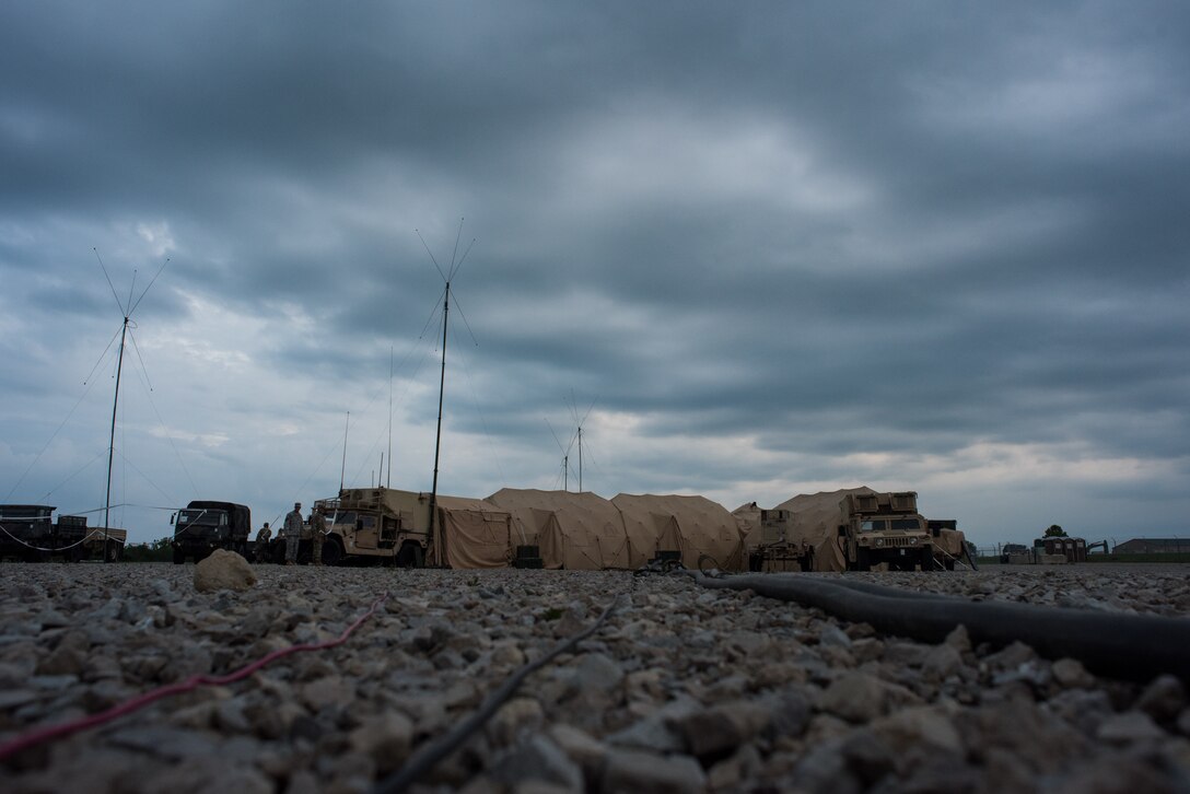 Soldiers with the Minnesota Army National Guard 1st Armored Brigade Combat Team, 34th Infantry Division, use a mobile tactical operations center to conduct combat simulations as a response cell during Warfighter 18-5 (WFX 18-5) June 11, 2018, at Camp Atterbury Joint Maneuver Training Center near Edinburgh, Indiana. WFX 18-5 was conducted to help components under the 34th Infantry Division become accustomed to using Army battle drills in a computer-simulated combat environment. (U.S. Air National Guard photo by Staff Sgt. Brigette Waltermire)