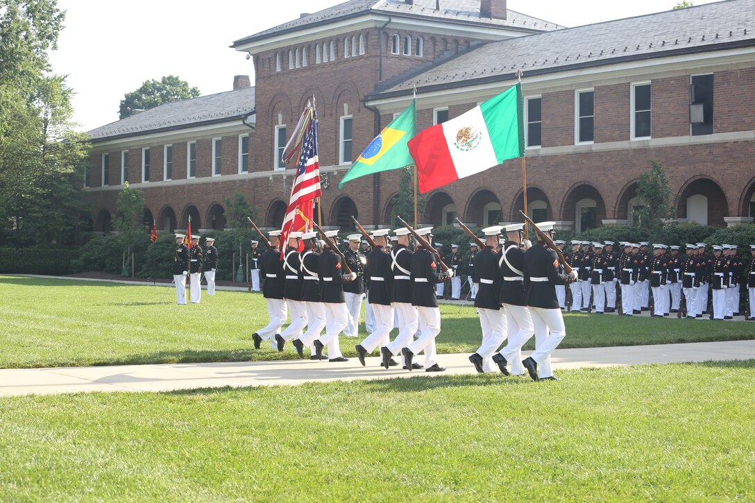 Marines with the U.S. Marine Color Guard post the Colors during a Troop Review Ceremony at Marine Barracks Washington D.C., June 18, 2018. The Barracks hosted our Brazilian and Mexican military counterparts to honor Commandant of the Brazil Corps of Naval Infantry, Adm. Alexandre Jose Bareto de Mattos, and Coordinator General, Mexico Naval Infantry, Vice Adm. Rafael Lopez Martinez.
