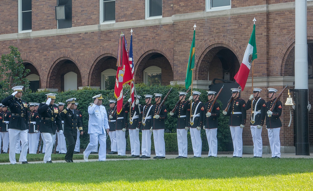 The official party renders a salute during a Troop Review Ceremony to honor military officials from Brazil and Mexico at Marine Barracks Washington D.C., June 18, 2018.