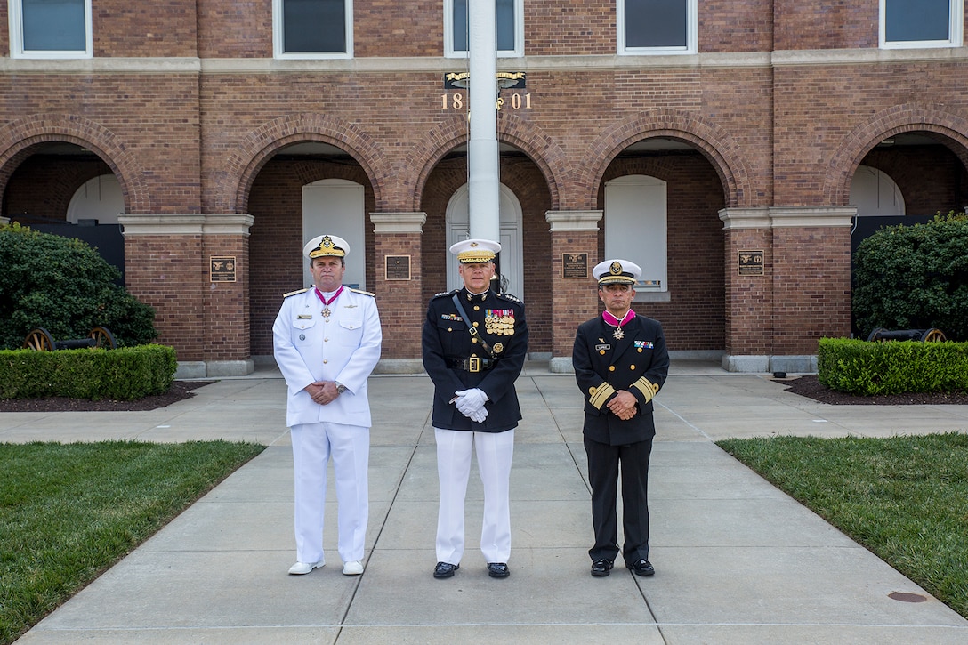 From left, Adm. Alexandre Jose Barreto de Mattos, Commandant of the Brazil Corps of Naval Infantry, Gen. Robert B. Neller, Commandant of the Marine Corps, and Vice Adm. Rafael Lopez Martinez, Coordinator General, Mexico Naval Infantry pose for a photo following a Troop Review Ceremony at Marine Barracks Washington D.C., June 18, 2018.