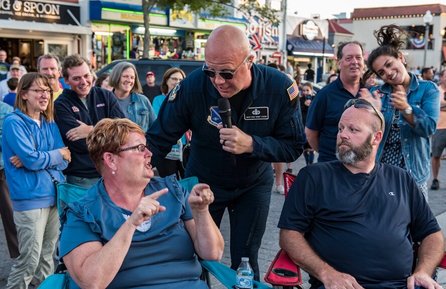 Senior Master Sgt. Ryan Carson, Max Impact superintendent and vocalist, sings with people in the audience June 16, 2018, at Rehoboth Beach, Del. Hundreds of beachgoers watched Max Impact perform for more than an hour during the Rehoboth Beach Bandstand Summer Concert Series. Max Impact, the premier rock band of the U.S. Air Force, is stationed at Joint Base Anacostia-Bolling in Washington, D.C. (U.S. Air Force photo by Roland Balik)