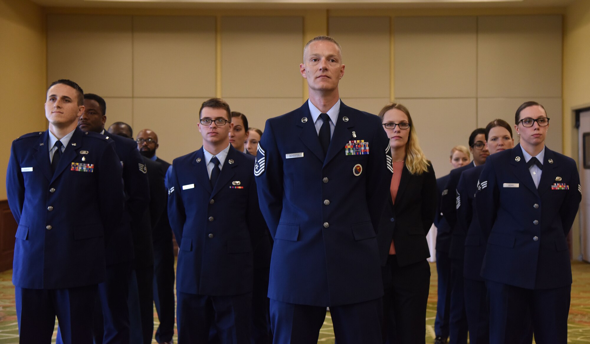 U.S. Air Force Senior Master Sgt. David Boydston, Airman Leadership School commandant, stands in formation with Keesler personnel during the 81st Force Support Squadron change of command ceremony in the Bay Breeze Event Center at Keesler Air Force Base, Mississippi, June 14, 2018. The passing of the guidon is a ceremonial symbol of exchanging command from one commander to another. (U.S. Air Force photo by Kemberly Groue)