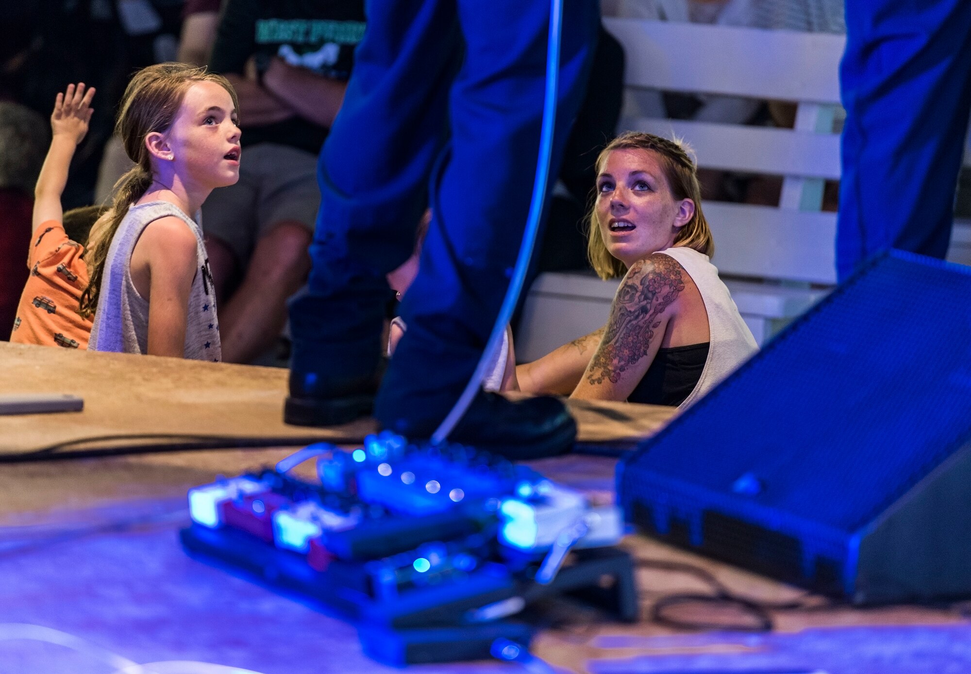 Two members of the audience listen to the band, Max Impact, as they perform June 16, 2018, on the bandstand at Rehoboth Beach, Del. Max Impact performed for more than an hour during the free, public Rehoboth Beach Bandstand Summer Concert Series. Max Impact, the premier rock band of the U.S. Air Force, is stationed at Joint Base Anacostia-Bolling in Washington, D.C. (U.S. Air Force photo by Roland Balik)