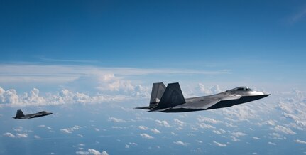 Two U.S. Air Force F-22 Raptors from the 1st Fighter Wing fly over Western Virginia, June 14, 2018.