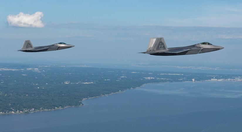 Two U.S. Air Force F-22 Raptors fly over Hampton Roads, Virginia, June 14, 2018.