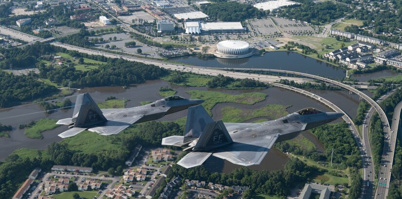 Two U.S. Air Force F-22 Raptors fly over Hampton, Virginia, June 14, 2018.