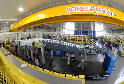 After being lifted into place using the overhead crane, a T-38 Talon fuselage is bolted in-place on a specialized jig to ensure that the frame stays in alignment during the PCIII modification package at Joint Base San Antonio-Randolph