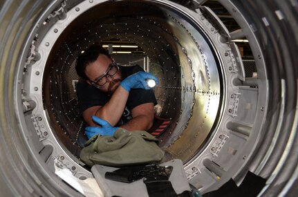 Jason Moore, 575th AMXS Maintenance Support Flight, inspects the inside of T-38 Talon boat tail section at Joint Base San Antonio-Randolph
