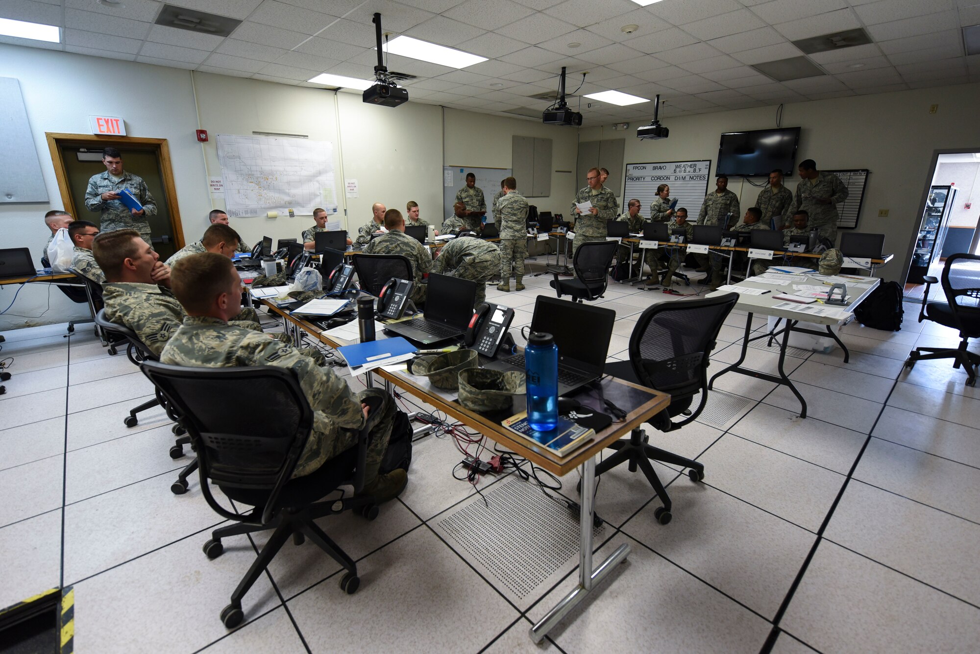 Airmen prepare for a readiness exercise on June 14, 2018, on Grand Forks Air Force Base, North Dakota. Readiness exercises ensure Airmen are prepared to deploy when called upon and provide an opportunity to hone the skills needed to quickly process Airmen. (U.S. Air Force photo by Airman 1st Class Melody Wolff)