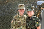Spc. Cheyanna Porter, left, assigned to the Ohio National Guard’s 838th Military Police Company, is deployed to Serbia for Exercise Platinum Wolf 2018, being conducted June 11-22, 2018. Porter has shared a tent with nearly 50 women from around the world, including Serbia, Romania and Bulgaria. Her bunk mate, Bulgarian Armed Forces Jr. Sgt. Smilena Volnova has been teaching Porter Bulgarian words and phrases throughout the exercise.