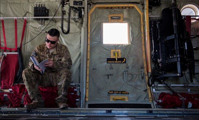 Master Sgt. William Freshley, 29th Weapons Squadron loadmaster, sits on a C-130J Super Hercules cargo aircraft prior to a U.S. Air Force Weapons School Advanced Integration (WSINT) mission on Nellis Air Force Base, Nevada, June 10, 2018. The first iteration of the Loadmaster Advanced Instructor Course (AIC) for the C-130J Super Hercules participated in WSINT from May 21 to June 13.  (U.S. Air Force photo by Senior Airman Kevin Tanenbaum)