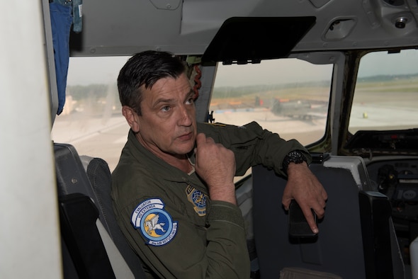 Master Sgt. Scott Dillinger, 6th Air Refueling Squadron noncommissioned officer in charge of standardization and evaluation and a KC-10 Extender flight engineer, sits in the cockpit of a KC-10 at Misawa Air Base, Japan, June 4, 2018 prior to flying a refueling mission. During the flight, Dillinger hit the 10,000 flight hour milestone. (U.S. Air Force photo by Tech. Sgt. James Hodgman)