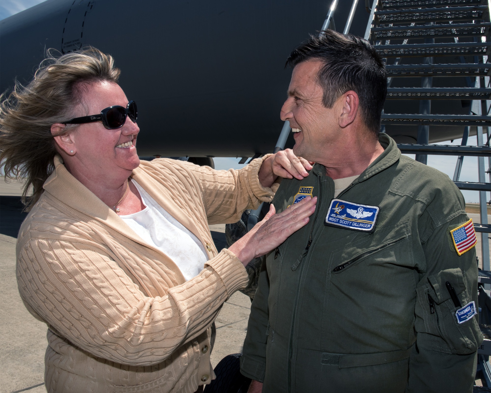 U.S. Air Force Master Sgt. Scott Dillinger, 6th Air Refueling Squadron noncommissioned officer in charge of standardization and evaluation and a KC-10 Extender flight engineer, arrives at Travis Air Force Base, Calif., June 6, 2018. Dillinger eclipsed the 10,000 flight hour mark and was greeted by family, friends and coworkers. (U.S. Air Force photo by Louis Briscese)