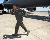 U.S. Air Force Master Sgt. Scott Dillinger, 6th Air Refueling Squadron noncommissioned officer in charge of standardization and evaluation and a KC-10 Extender flight engineer, arrives at Travis Air Force Base, Calif., June 6, 2018. Dillinger eclipsed the 10,000 flight hour mark and was greeted by family, friends and coworkers. (U.S. Air Force photo by Louis Briscese)