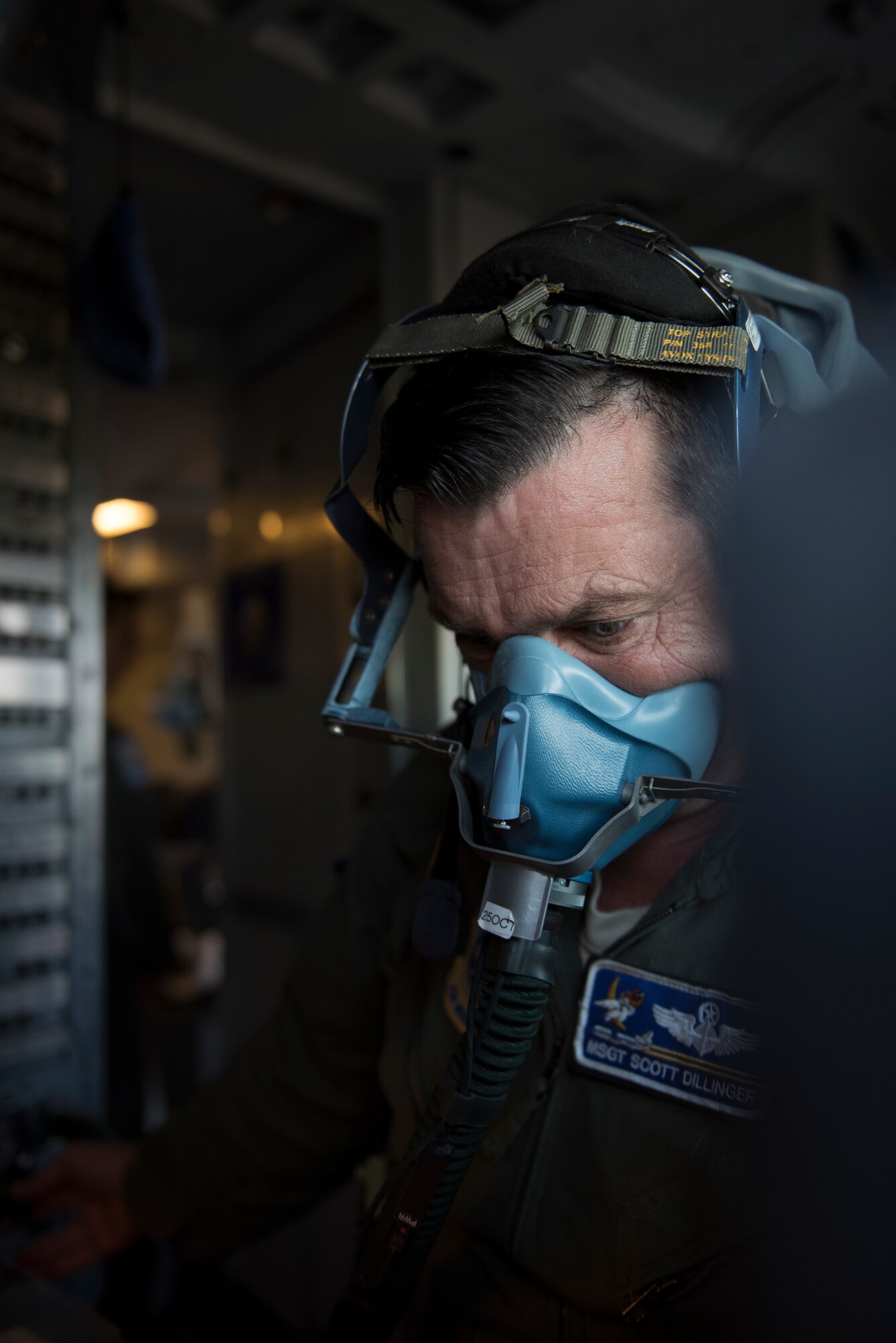 Master Sgt. Scott Dillinger, 6th Air Refueling Squadron noncommissioned officer in charge of standardization and evaluation and a KC-10 Extender flight engineer, conducts a check of an oxygen mask inside the cockpit of a KC-10 at Eielson Air Force, Base, Alaska, June 6, 2018. Dillinger and his crew flew the aircraft to support refueling operations in the Pacific theater. During the five-day mission, Dillinger surpassed 10,000 flight hours. (U.S. Air Force photo by Tech. Sgt. James Hodgman)