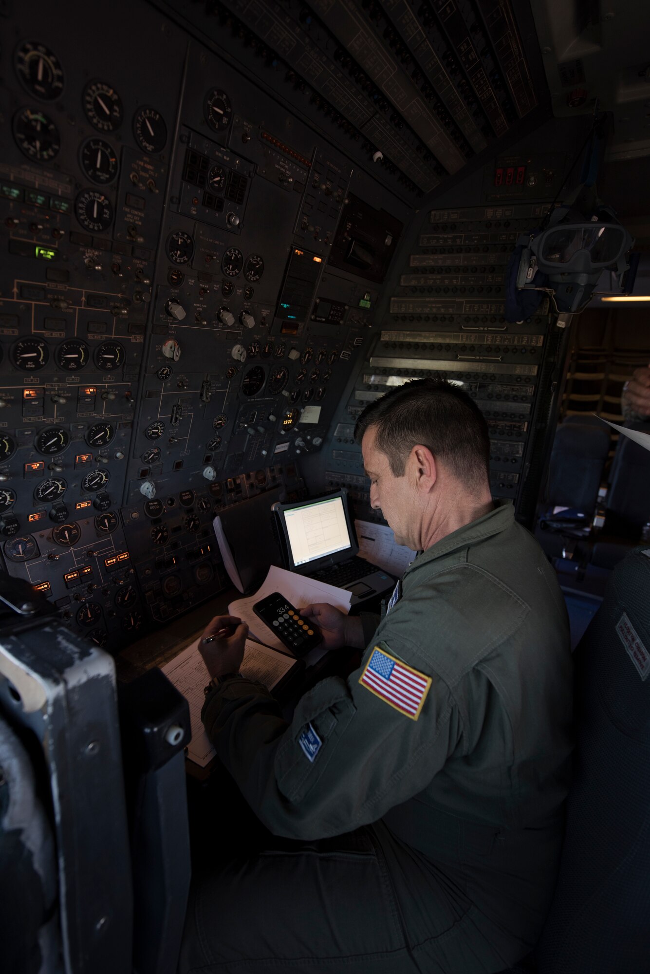Master Sgt. Scott Dillinger, 6th Air Refueling Squadron noncommissioned officer in charge of standardization and evaluation and a KC-10 Extender flight engineer, conducts pre-flight checks inside the cockpit of a KC-10 at Eielson Air Force, Base, Alaska, June 6, 2018. Dillinger and his crew flew the aircraft to support refueling operations in the Pacific theater. During the five-day mission, Dillinger surpassed 10,000 flight hours. (U.S. Air Force photo by Tech. Sgt. James Hodgman)
