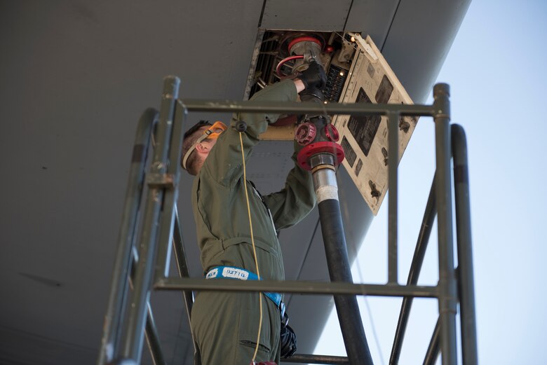 Staff Sgt. Nicholas Kinzer, 660th Aircraft Maintenance Squadron KC-10 Extender assistant flying crew chief, services a KC-10 prior to a refueling mission in the Pacific theater at Eielson Air Force Base, Alaska, June 2, 2018. Kinzer served as one of two crew chiefs on the KC-10 for a five-day refueling mission. Flying crew chiefs are responsible for maintaining aircraft during missions away from that aircraft’s home station. (U.S. Air Force photo by Tech. Sgt. James Hodgman)