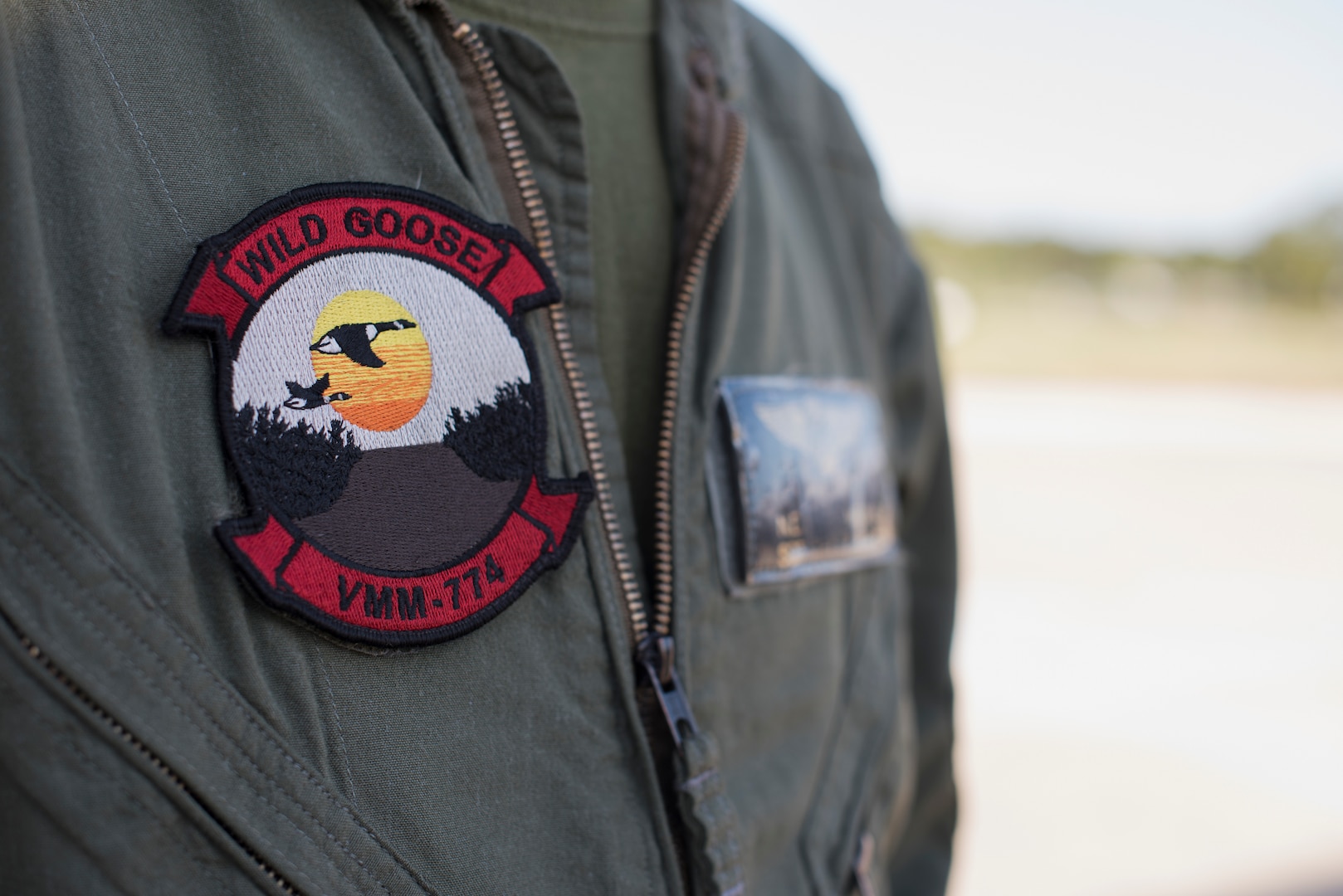 U.S. Marine Corps Sgt. Christopher Stewart, Marine Medium Tilt Roader Squadron (VMM) 774 crew chief, poses for a picture during a forward air-refueling point exercise on Coast Guard Air Station Atlantic City, N.J., June 14, 2018. Stewart said the importance of setting up this new forward air-refueling point is to be able to work jointly with sister services to keep the mission flowing, blurring the differences between each by intertwining their standard operating procedures. (U.S. Air Force photo by Airman Ariel Owings)