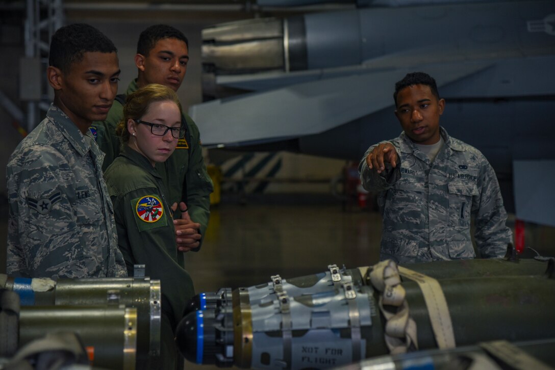 U.S. Air Force Senior Airman Farhan Howard, a 35th Maintenance Group weapons lead crew member, showcases munitions to visiting United States Air Force Academy cadets at Misawa Air Base, Japan, June 13, 2018. The cadets visited various squadrons around base as part of Operation Air Force, a two-week visit that allowed the cadets to see career fields available to them upon graduation from the Academy. (U.S. Air Force photo by Airman 1st Class Collette Brooks)