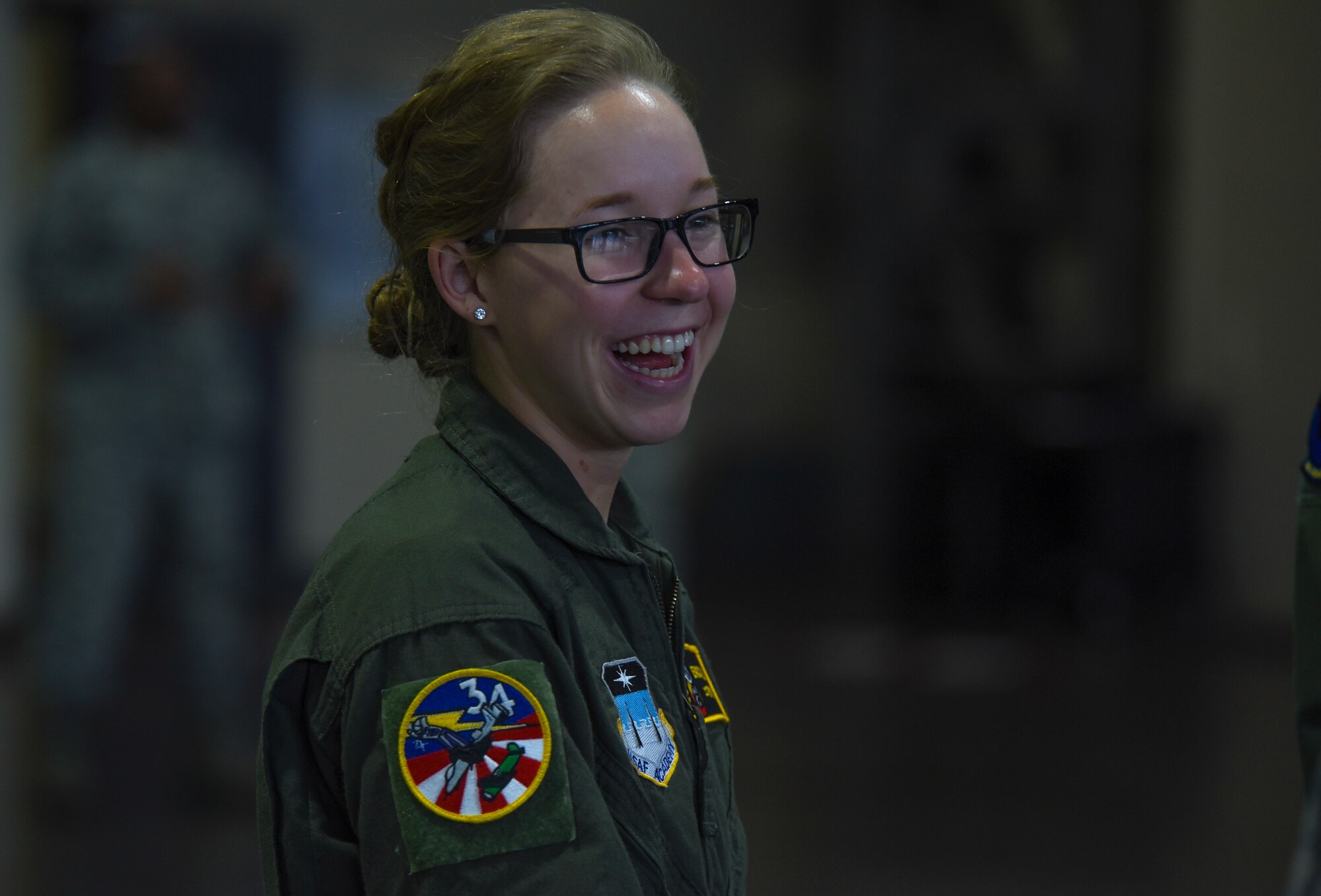 Cadet 2nd Class Erica Lee, an Air Force Academy cadet, smiles during her munitions tour at Misawa Air Base, Japan, June 13, 2018. Before their junior year, cadets spend two weeks at an operational Air Force base receiving a first-hand experience of various careers offered in the Air Force. (U.S. Air Force photo by Airman 1st Class Collette Brooks)