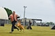Cadet 2nd Class Ben Pagel, an Air Force Academy cadet, runs from a military working dog during a demonstration at Misawa Air Base, Japan, June 18, 2018. Before their junior year at the Academy, cadets visit an active duty Air Force base to learn more about the operational Air Force and its career fields. (U.S. Air Force photo by Airman 1st Class Collette Brooks)