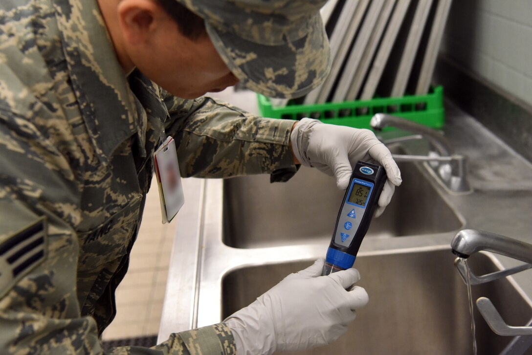 An Airman assigned to the 48th Aerospace Medicine Squadron Bioenvironmental Engineering flight checks the acidity levels of the drinking water at Royal Air Force Lakenheath, England, June 19, 2018. The 48th AMDS, Bioenvironmental Engineering flight uses engineering principles to check for pollutants and radioactive materials, implementing environmental protections, monitoring OSHA and NRC work safety standards and permits, and other duties to reduce health risks and dangers to Airmen. (U.S. Air Force photo/ Airman 1st Class John A. Crawford)