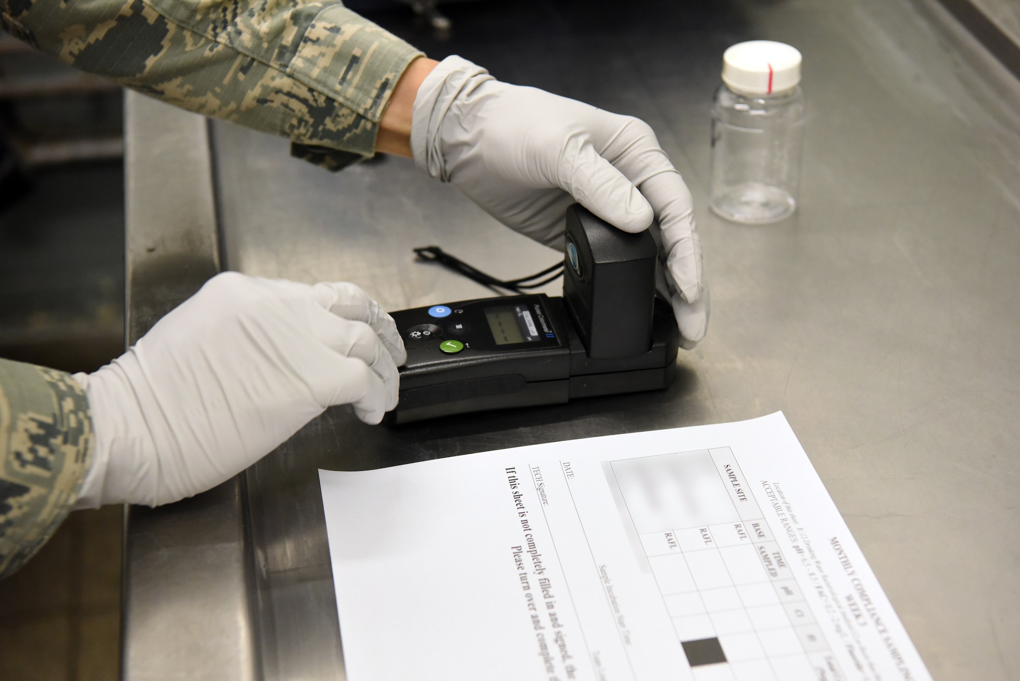 An Airman assigned to the 48th Aerospace Medicine Squadron Bioenvironmental Engineering flight tests the acidity levels of the drinking water at Royal Air Force Lakenheath, England, June 19, 2018. The 48th AMDS, Bioenvironmental Engineering flight uses engineering principles to check for pollutants and radioactive materials, implementing environmental protections, monitoring OSHA and NRC work safety standards and permits, and other duties to reduce health risks and dangers to Airmen. (U.S. Air Force photo/ Airman 1st Class John A. Crawford)