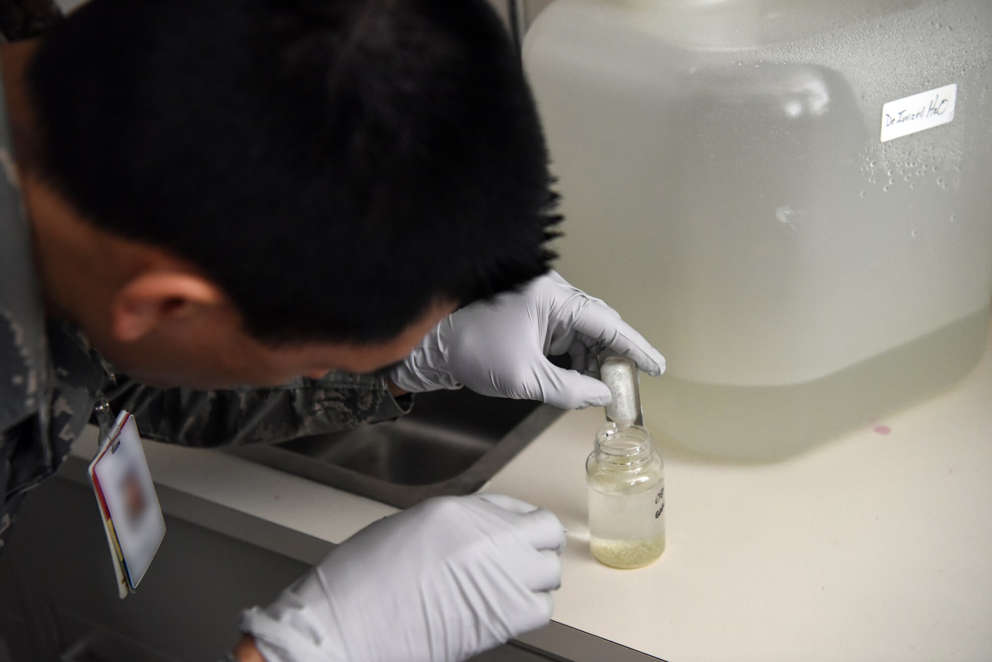 An Airman assigned to the 48th Aerospace Medicine Squadron Bioenvironmental Engineering flight tests the acidity levels of the drinking water at Royal Air Force Lakenheath, England, June 19, 2018. The 48th AMDS, Bioenvironmental Engineering flight uses engineering principles to check for pollutants and radioactive materials, implementing environmental protections, monitoring OSHA and NRC work safety standards and permits, and other duties to reduce health risks and dangers to Airmen. (U.S. Air Force photo/ Airman 1st Class John A. Crawford)