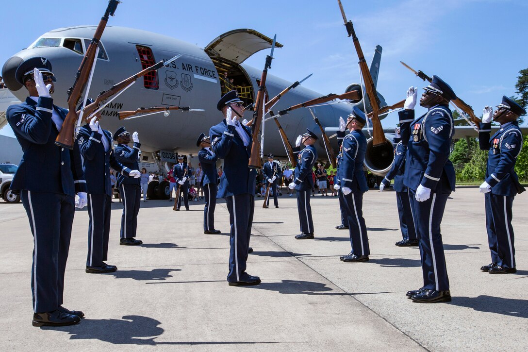 The U.S. Air Force Honor Guard Drill Team performs in front of visitors at the Innovations in Flight Family Day and Outdoor Aviation Display at the Steven F. Udvar-Hazy Center, Chantilly, Virginia, June 16, 2018. A standard Drill Team performance includes a sequence of weapon maneuvers, tosses, exchanges, and a walk through the gauntlet of spinning bayoneted rifles. (U.S. Air Force photo by Master Sgt. Mark C. Olsen)