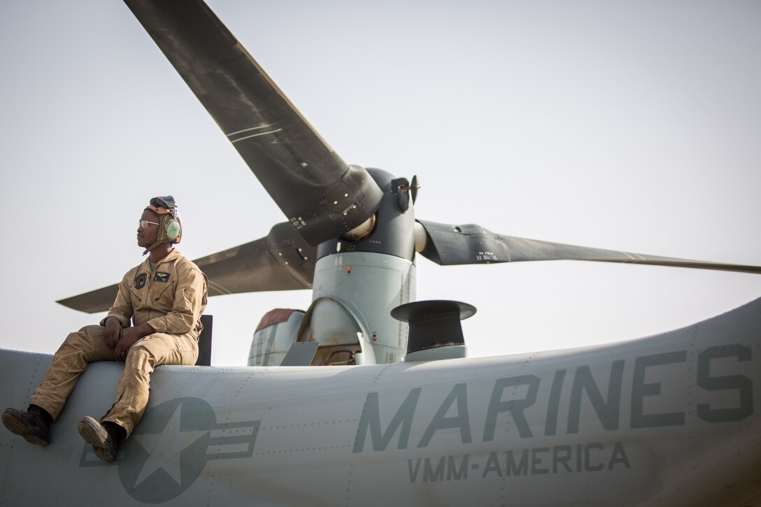 U.S. Marine Corps Cpl. Burman Bedford, an MV-22 Osprey Crew Chief with Marine Medium Tilt Roader Squadron 164 attached to U.S. Marine Corps Forces Central Command, observes routine maintenance of an MV-22 Osprey May 2, 2018. The Osprey squadron increases mobility and capabilities as a part of the Special Purpose Marine Air Ground Task Force Crisis Response Central Command 18.2.