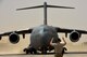 Airman 1st Class Bret Miller, 442nd Air Expeditionary Squadron Aerial Port Team transient alert, marshalls a C-17 Globemaster III, June 14, 2018, at Erbil, Iraq.