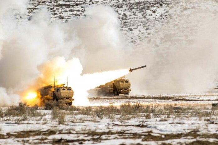 Soldiers fire rockets during artillery training.
