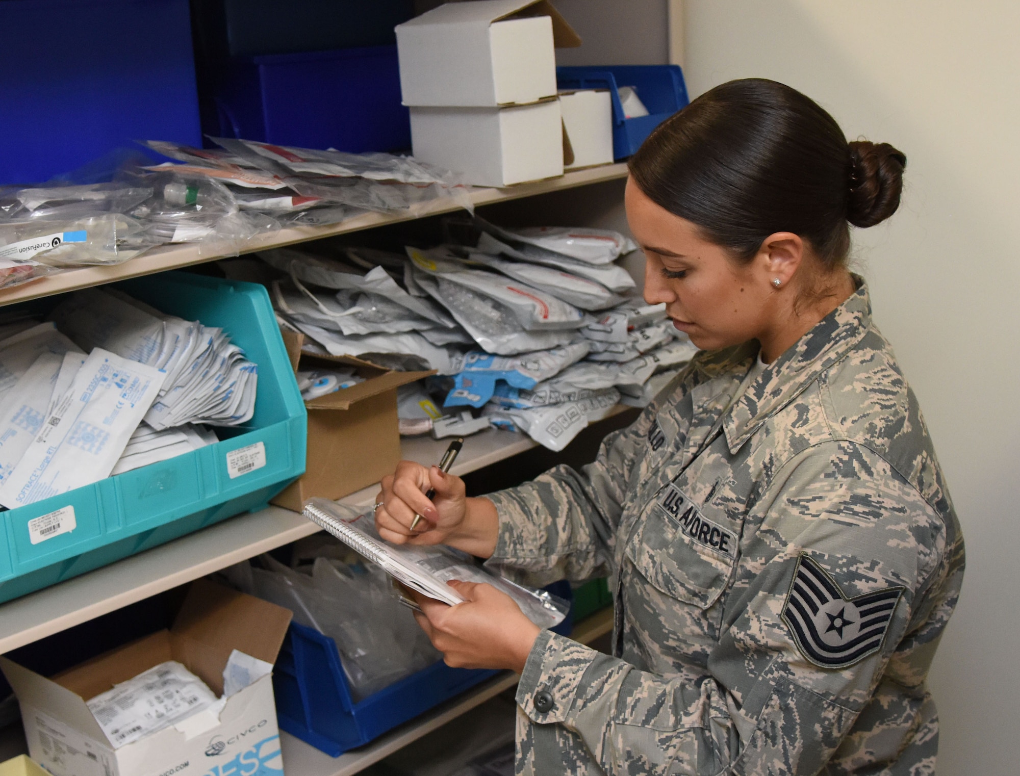 U.S. Air Force Tech. Sgt. Juliet Corcillo, 81st Medical Operations Squadron Emergency Department NCO in charge, completes a daily supply inventory list for the Keesler Medical Center emergency department at Keesler Air Force Base, Mississippi, June 14, 2018. Corcillo will begin her first day of medical school July 6 with a four-year scholarship from the Air Force’s Health Professions Scholarship Program. (U.S. Air Force photo by Kemberly Groue)