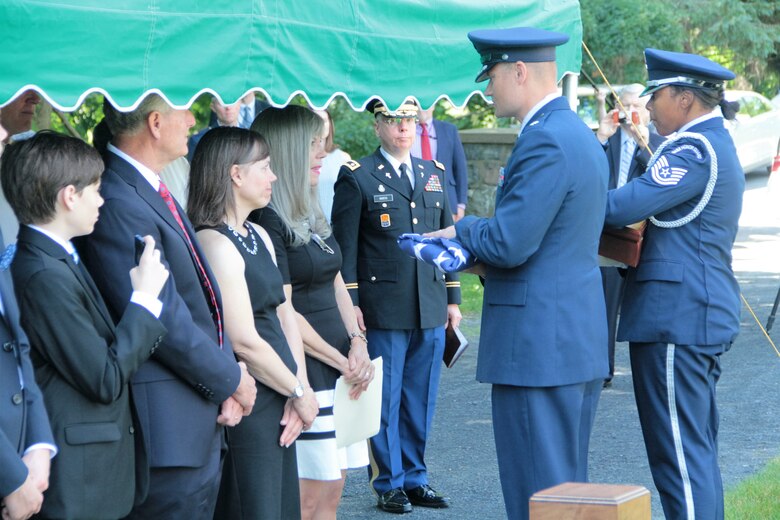 Air Force Lt. Col. Scott Woodbrey, U.S. Military Academy, West Point, instructor, presents the flag to Sharon Cook, the widow of Maj. James White, a fighter pilot who went missing in Southeast Asia in 1969, at West Point, N.Y., June 19, 2018. White was finally laid to rest at West Point alongside his mother, father and brother. (Courtesy photo)