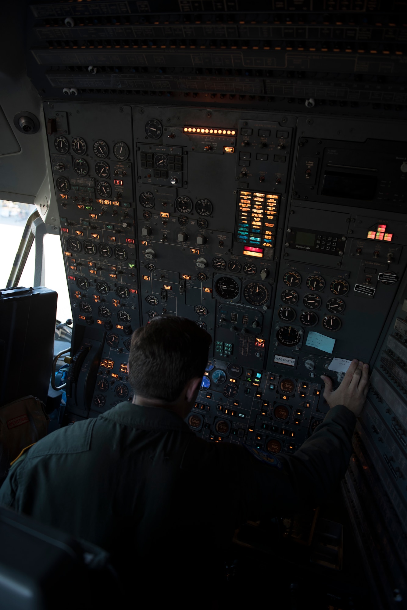 U.S. Air Force Staff Sgt. Ben Clouse, 6th Air Refueling Squadron KC-10 Extender flight engineer, conducts a check of flight systems inside a KC-10 at Travis Air Force Base, Calif., June 1, 2018. The aircraft completed a five-day mission which featured refueling U.S. Air Force and Japan Air Self-Defense Force fighter aircraft in the Indo-Pacific Command area of operations. (U.S. Air Force photo by Tech. Sgt. James Hodgman)