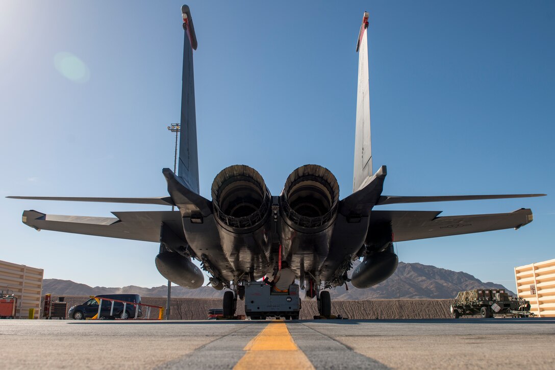 A 391st Fighter Squadron crew chief troubleshoots an F-15E Strike Eagle starter during Green Flag West, June 11, 2018, at Nellis Air Force Base, Nevada. The 391st FS participated in Green Flag to further enhance readiness by training on Close Air Support over the National Training Center, Fort Irwin, California. (U.S. Air Force photo by Airman 1st Class JaNae Capuno)
