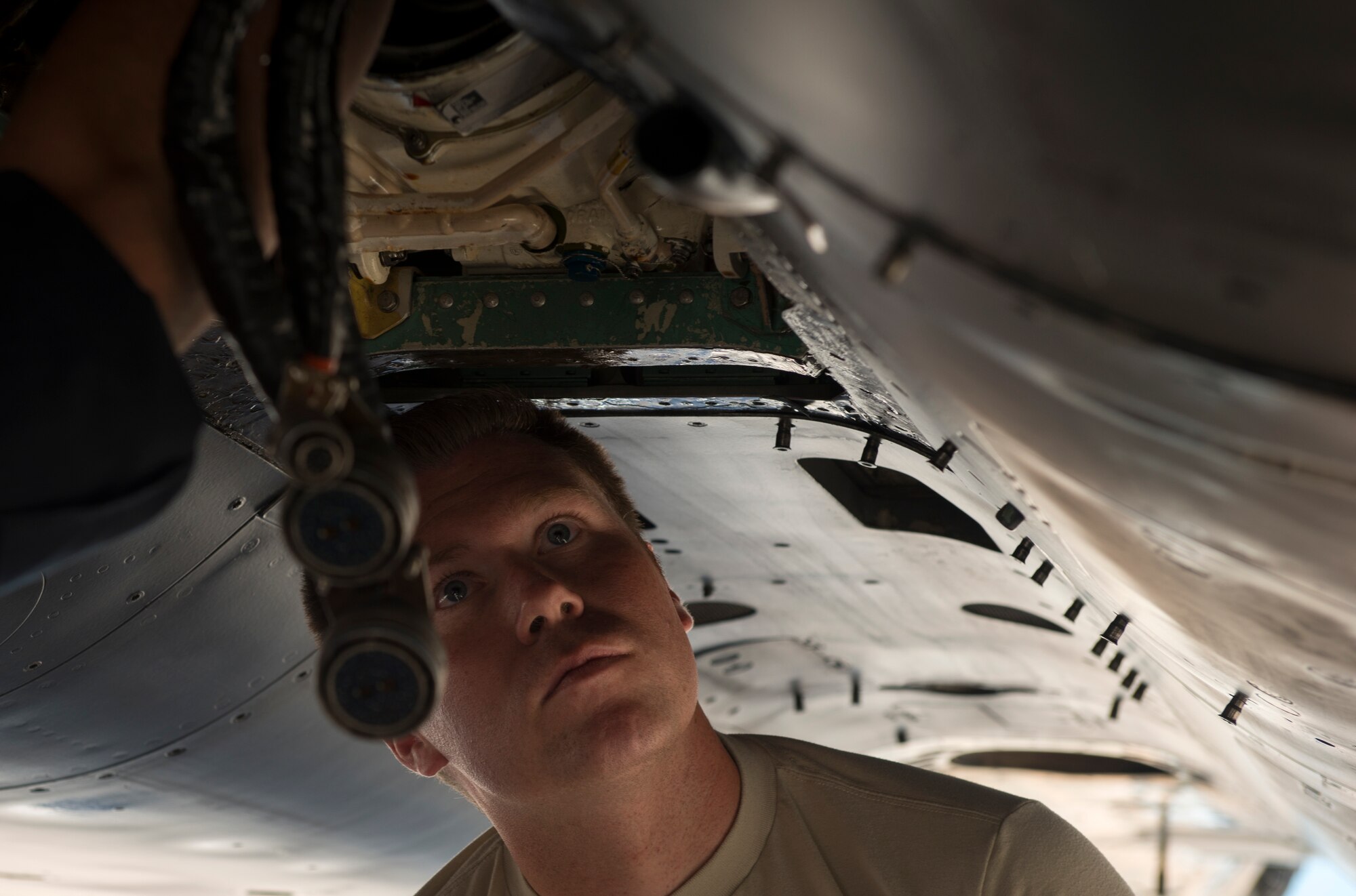 Tech. Sgt. Tyler Borgstrom, 391st Fighter Squadron crew chief, inspects an F-15E Strike Eagle central gearbox jet fuel starter during Green Flag West, June 11, 2018, at Nellis Air Force Base, Nevada. The 391st FS participated in Green Flag to further enhance readiness by training on Close Air Support over the National Training Center, Fort Irwin, California. (U.S. Air Force photo by Airman 1st Class JaNae Capuno)