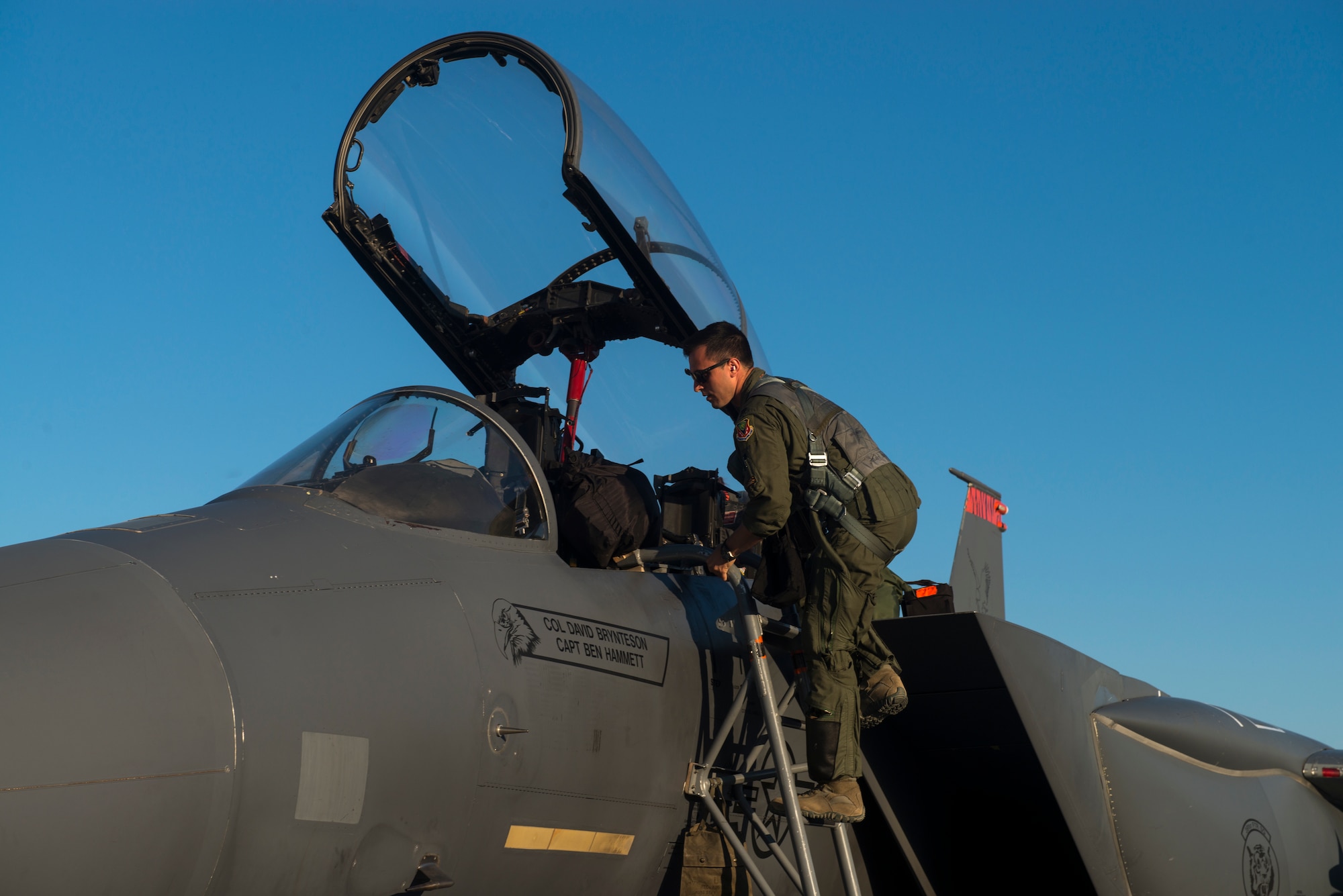 Capt. Jesse Loya, 391st Fighter Squadron pilot, steps into an F-15E Strike Eagle during Green Flag West, June 13, 2018, at Nellis Air Force Base, Nev. The 391st FS participated in the Green Flag exercise to enhance readiness by training on Close Air Support over the National Training Center, Fort Irwin, Calif. (U.S. Air Force photo by Airman 1st Class JaNae Capuno)