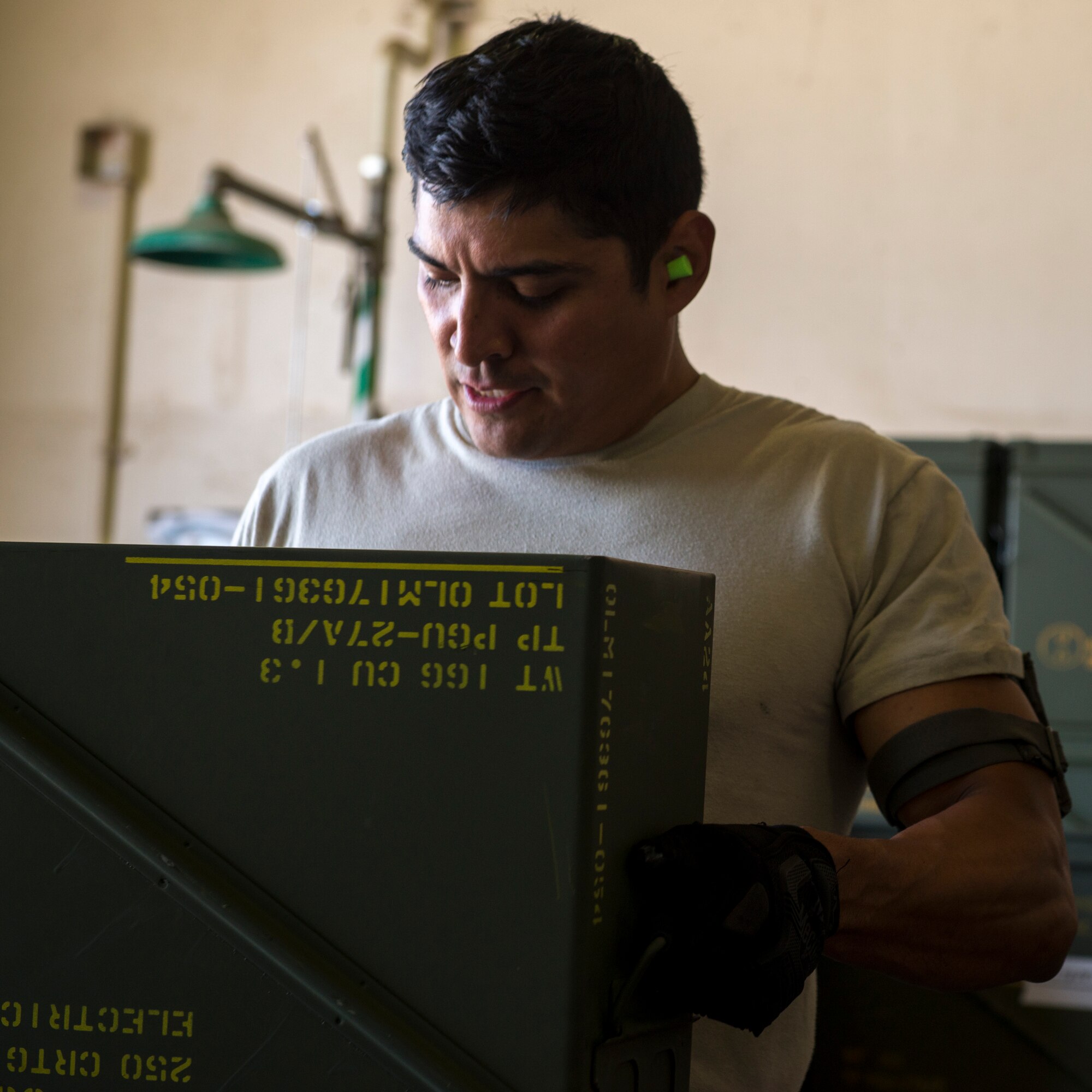 Staff Sgt. Kevin Mejia, 57th Equipment Maintenance Squadron conventional crew member, prepares an munitions crate for loading during Green Flag West, June 11, 2018, at Nellis Air Force Base, Nevada. The 366th EMS augmented 57th EMS Airmen during Green Flag. This exercise enhanced readiness by providing Close Air Support training over the National Training Center, Fort Irwin, California. (U.S. Air Force photo by Airman 1st Class JaNae Capuno)