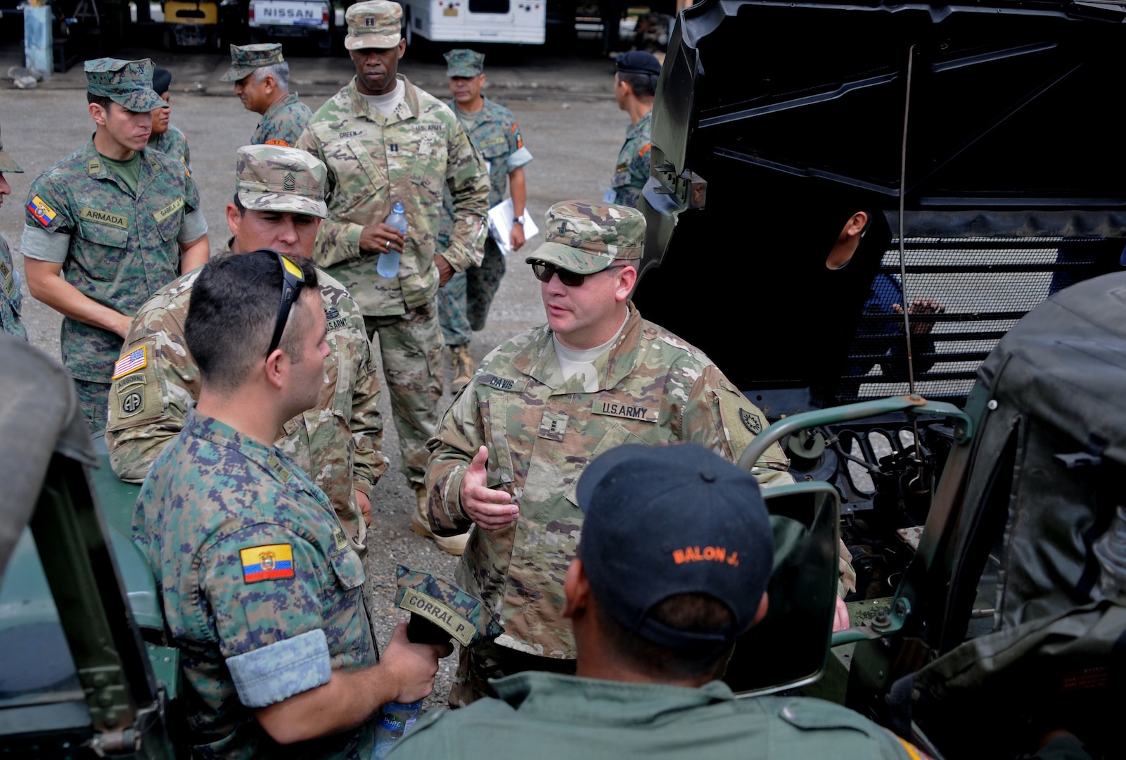 U.S. and Ecuadorean military members talk.