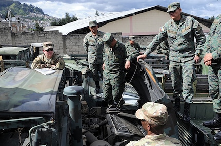 Soldiers from the Kentucky National Guard inspect and assess HMMWVs along with the Ecuadorian army in Quito, Ecuador, on June 4, 2018. This visit was part of the State Partnership Program between Kentucky National Guard and Ecuadorian Military, which is focused on conducting exchanges in military and civilian best practices.