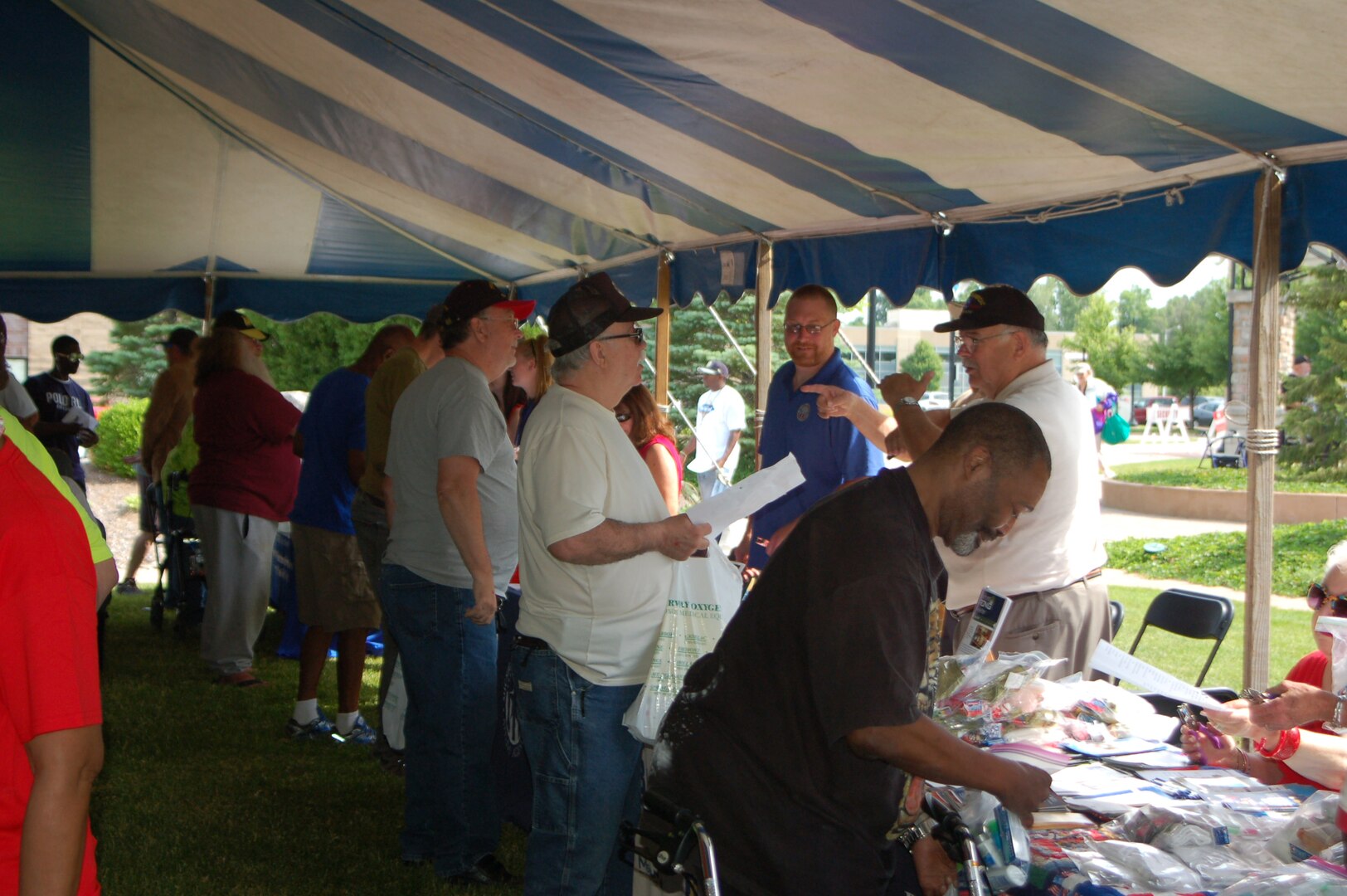 Veterans speak with representatives at a variety of information stations to learn more about resources available to them from Veterans Affairs other organizations.