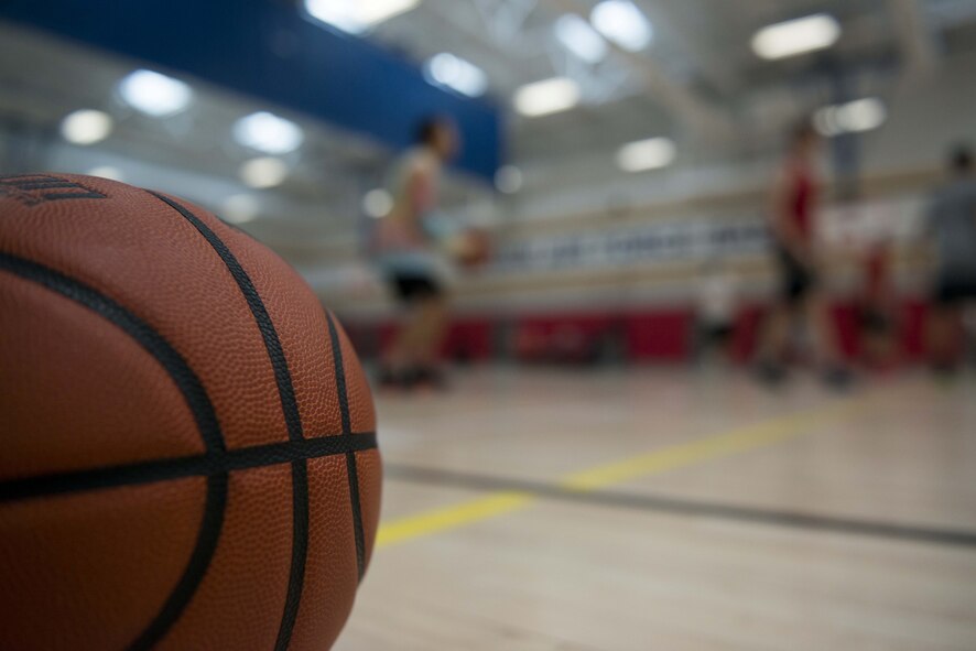 Team Shaw Airmen warm up before the Four Chaplains 3-on-3 Basketball Tournament at the 20th Force Support Squadron main fitness center at Shaw Air Force Base, S.C., June 15, 2018.