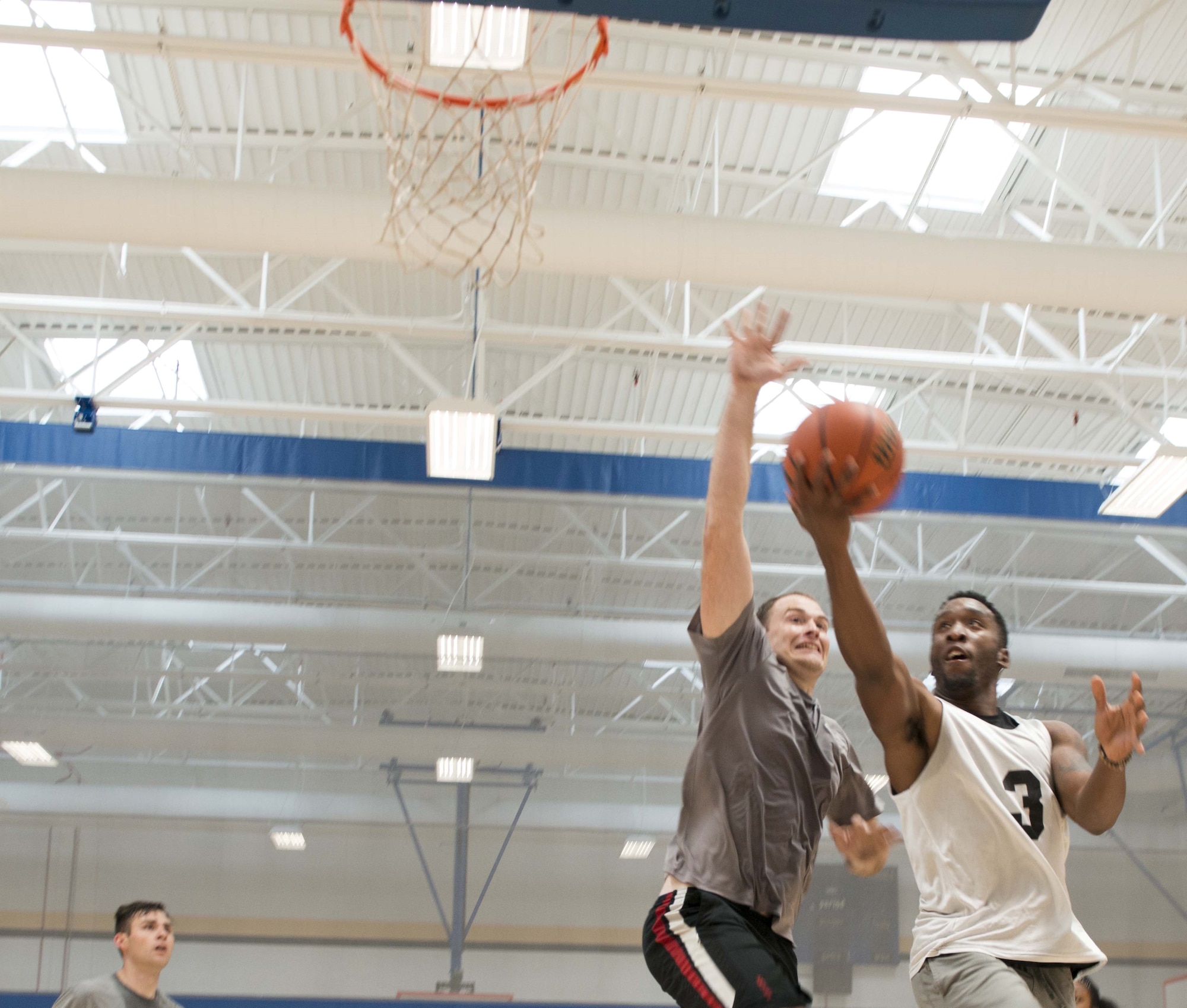 Team Shaw members compete during the Four Chaplains 3-on-3 Basketball Tournament at the 20th Force Support Squadron main fitness center at Shaw Air Force Base, S.C., June 15, 2018.