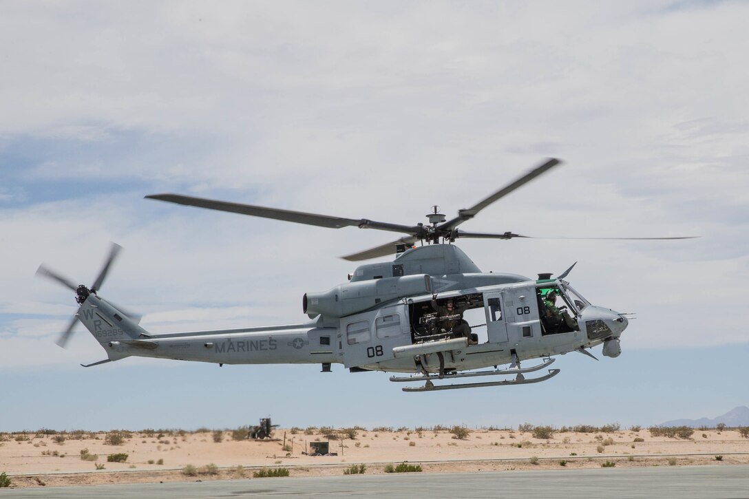 Marines with Marine Light Attack Helicopter Squadron 775, Marine Aircraft Group 41, 4th Marine Aircraft Wing, take off on a UH-1Y Venom during Integrated Training Exercise 4-18 at Marine Corps Air Ground Combat Center Twentynine Palms, Calif., June 15, 2018. ITX 4-18 provides Marine Air Ground Task Force elements an opportunity to undergo a service-level assessment of core competencies that are essential to expeditionary, forward-deployed operations. (U.S. Marine Corps photo by Lance Cpl. Samantha Schwoch/released)