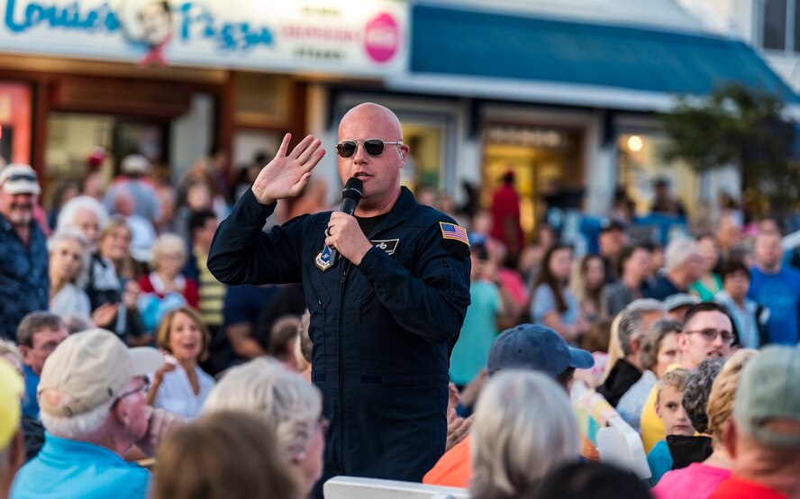 Senior Master Sgt. Ryan Carson, Max Impact superintendent and vocalist, walks in the audience during a performance June 16, 2018, at Rehoboth Beach, Del. Hundreds of beachgoers watched Max Impact perform for more than an hour during the Rehoboth Beach Bandstand Summer Concert Series. Max Impact, the premier rock band of the U.S. Air Force, is stationed at Joint Base Anacostia-Bolling in Washington, D.C. (U.S. Air Force photo by Roland Balik)